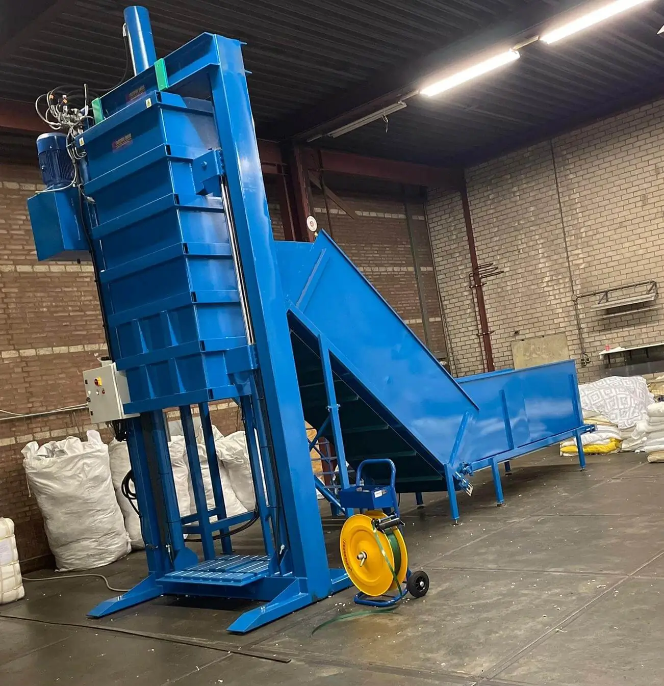 Balenmachine voor textielverwerking